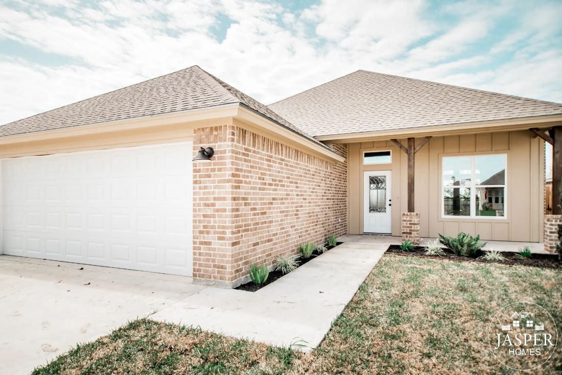 Brick custom home front walkway and covered entry
