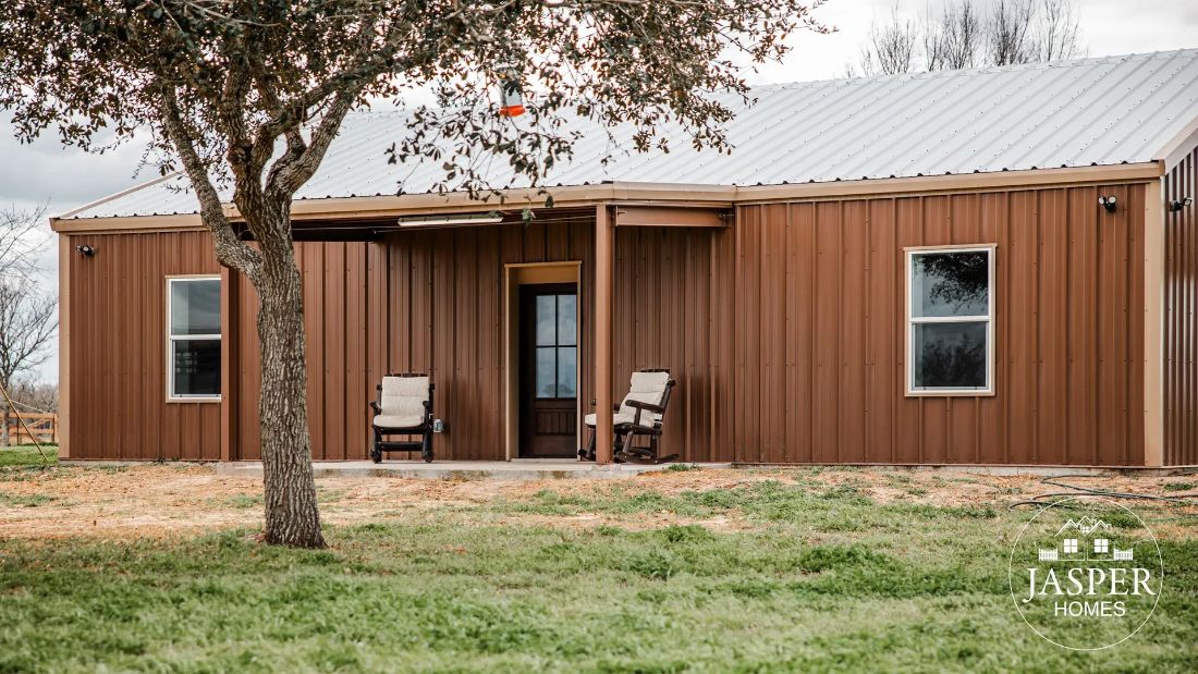 Copper metal barndominium with covered porch