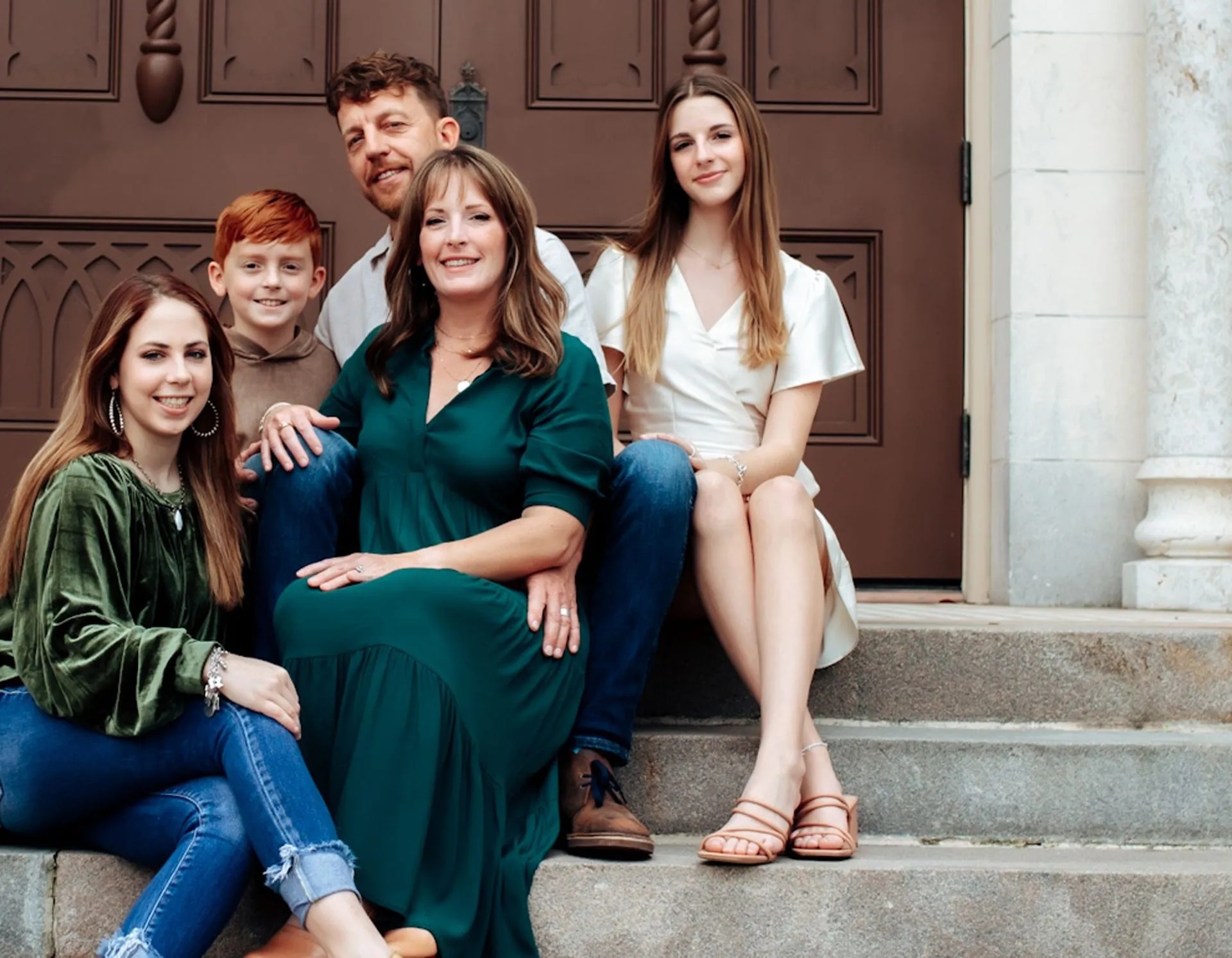 Jason Garvel and his family on the steps of a historic Victoria, Texas church