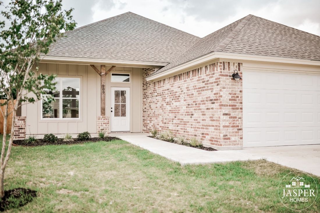 Brick and board-and-batten new construction home entry